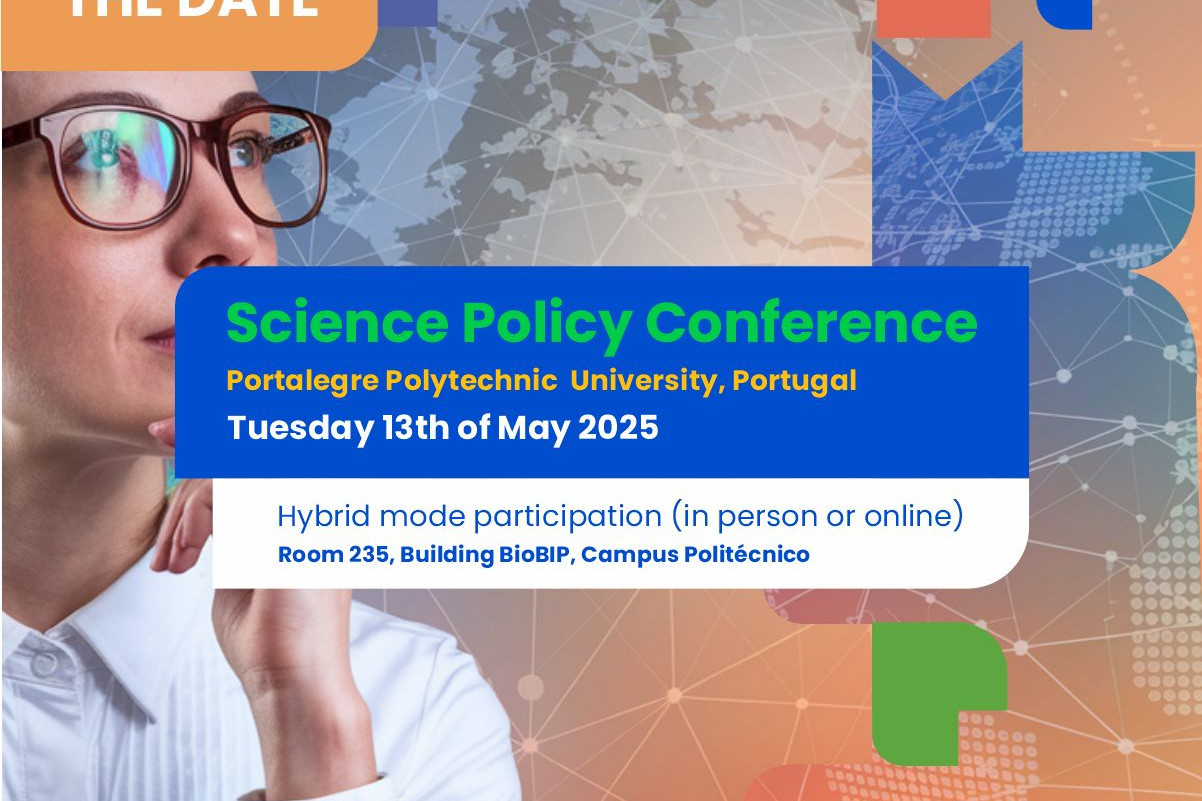 People walking through a bright indoor hallway with glass walls and shops.