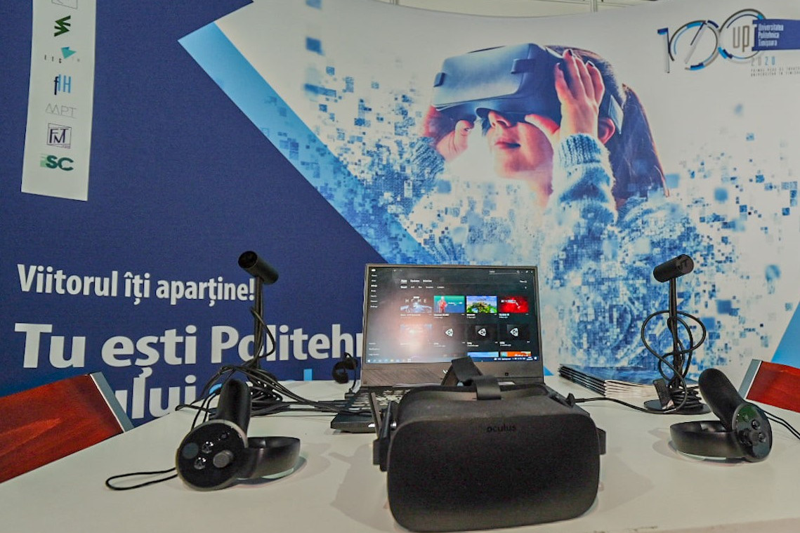 People walking through a bright indoor hallway with glass walls and shops.
