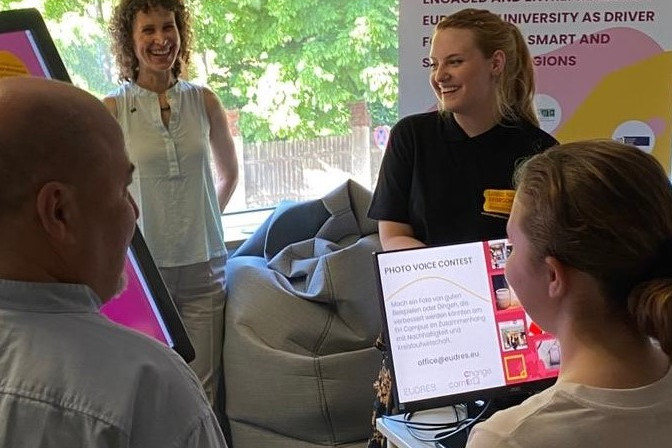 blurred photo of people at an event.