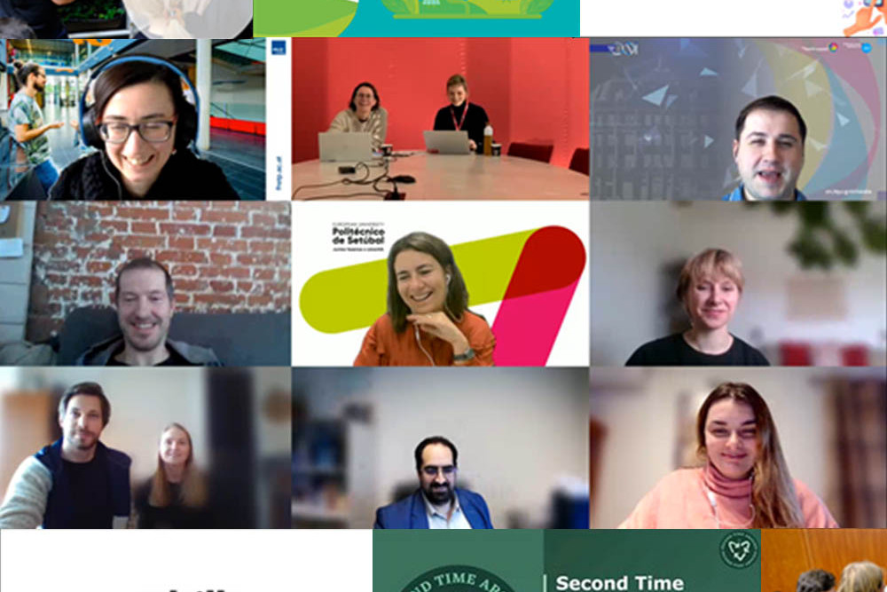 People walking through a bright indoor hallway with glass walls and shops.