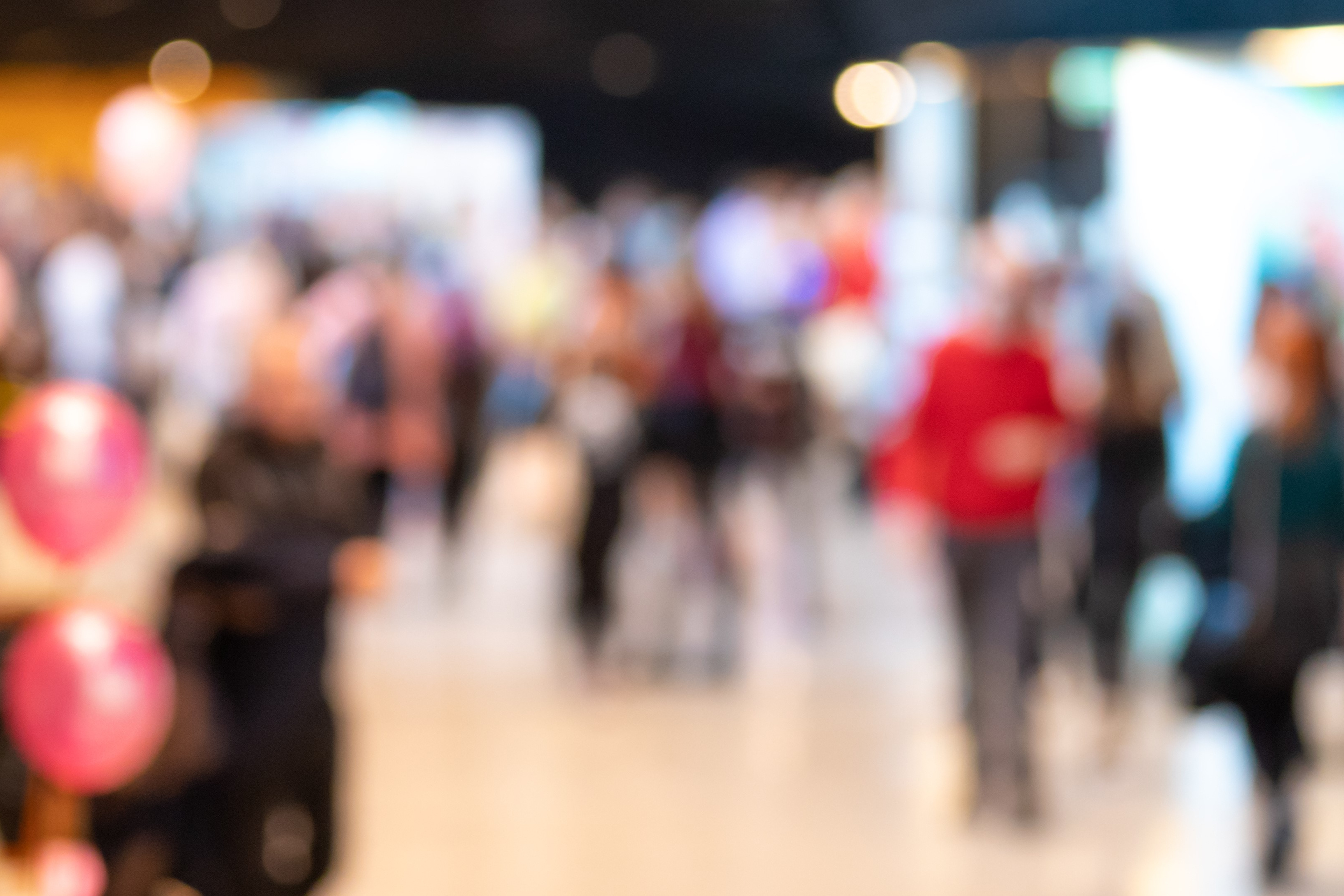 blurred photo of people at an event.